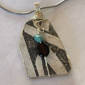 Stone wrapped in silver wire adorned with turquoise onyx necklace